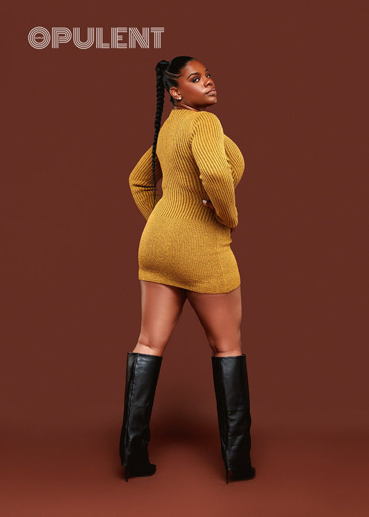 Green mini sweater dress with leather zipper detail styled with boots, curve-hugging knit fit shown from the side