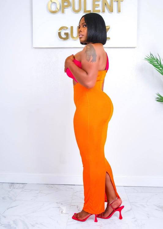 Side view of the Out Of Town Dress showcasing body-hugging fit, maxi length, and curve-accentuating silhouette