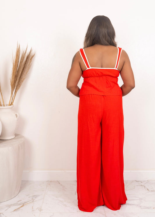 Back of red two-piece set with wide-leg pants and adjustable crop top straps – bold summer fashion from Opulent Gurlz.