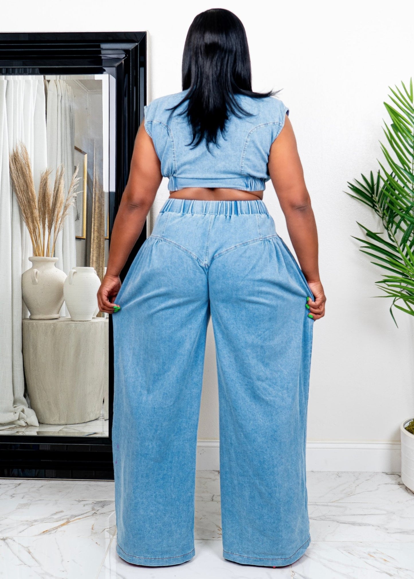Back view of tall woman wearing soft blue two-piece set with high-waisted wide-leg pants and cropped collared top – stylish matching outfit from Opulent Gurlz.
