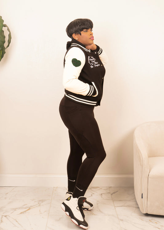 women’s varsity jacket styled with leggings and sneakers for sporty athleisure streetwear look
