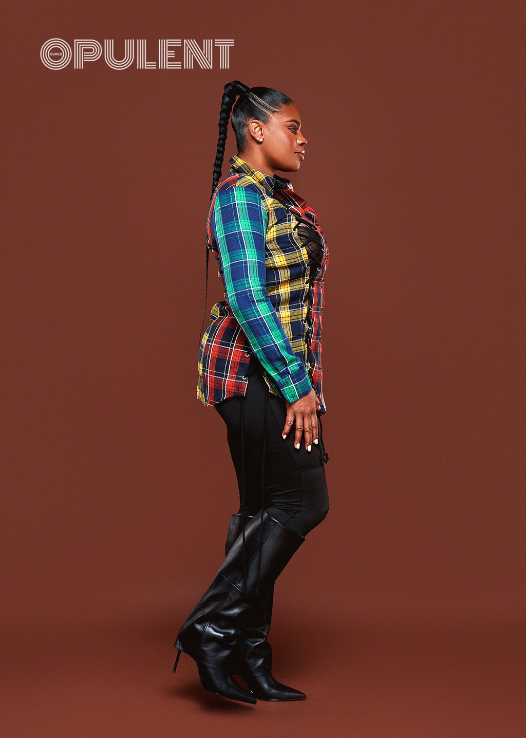 Side profile of a vibrant plaid drawstring shirt with ruched side and long sleeves, styled for casual chic look