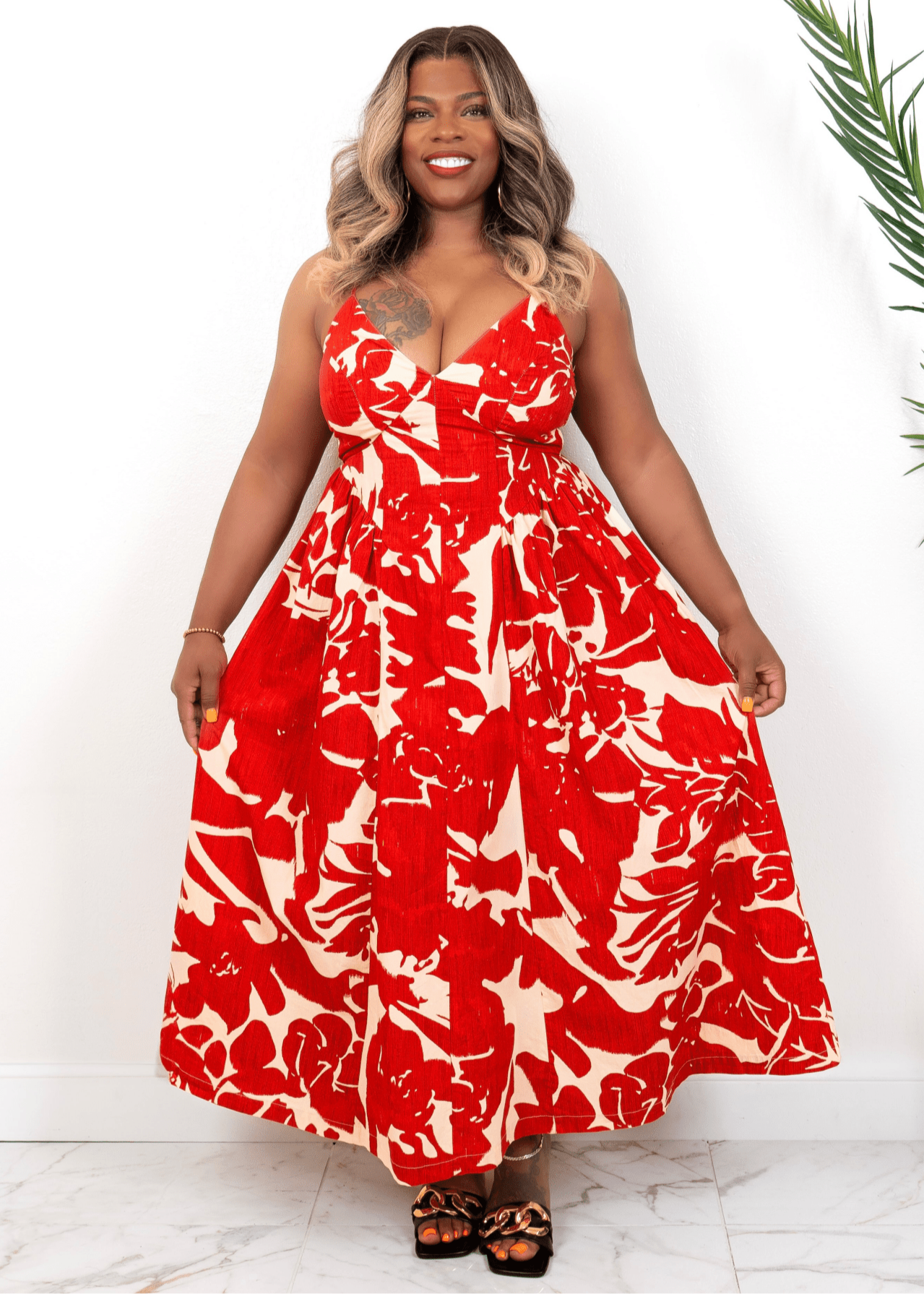 Front view of red floral maxi dress on curvy model – bold summer vacation dress  from Opulent Gurlz
