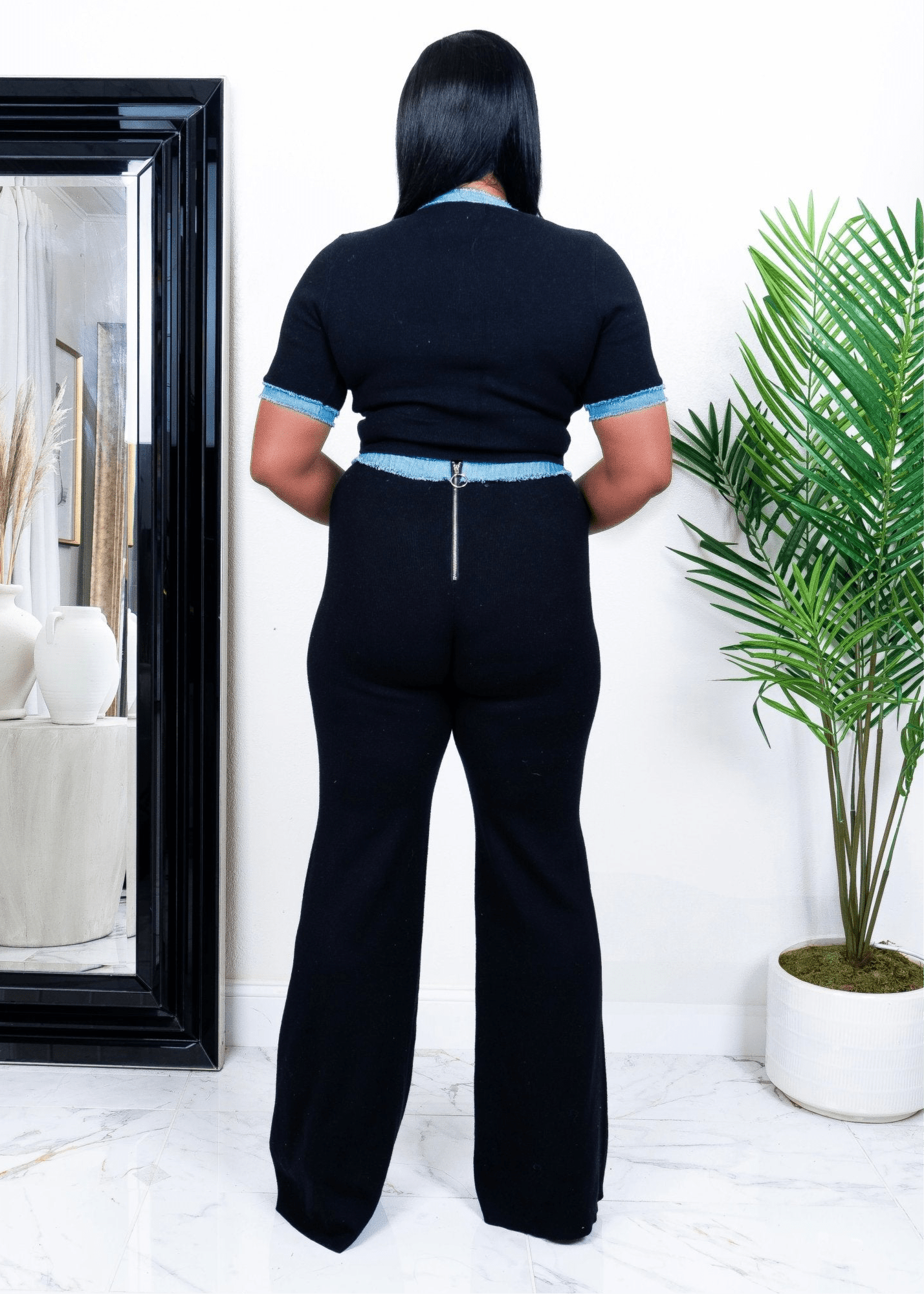 Back view of  wearing black wide-leg pants with fitted short-sleeve top from Opulent Gurlz – tall girl friendly stretch two-piece set
