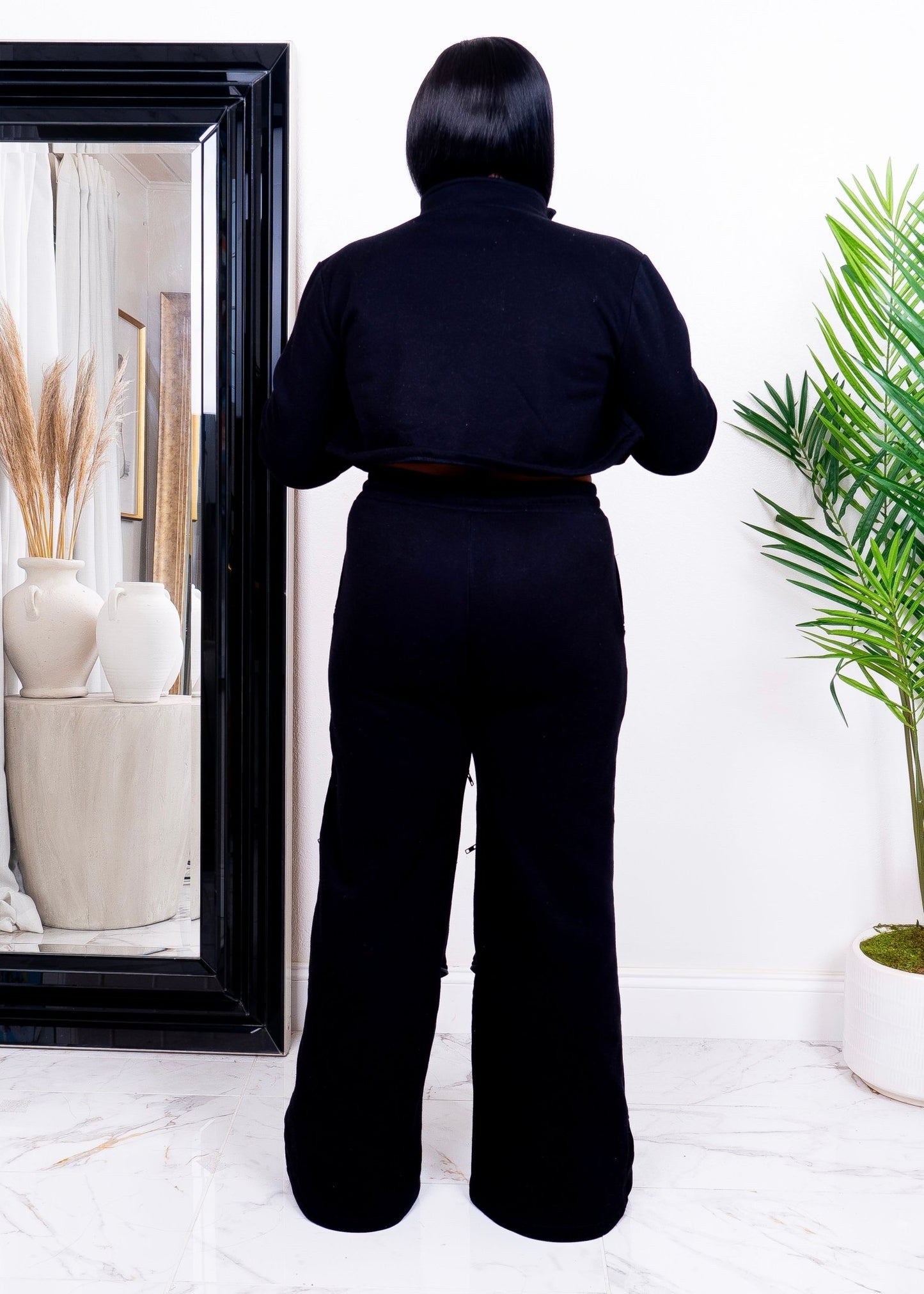 Back view of black two-piece set women’s streetwear set with cropped jacket and wide-leg pants – Opulent Gurlz boutique fashion