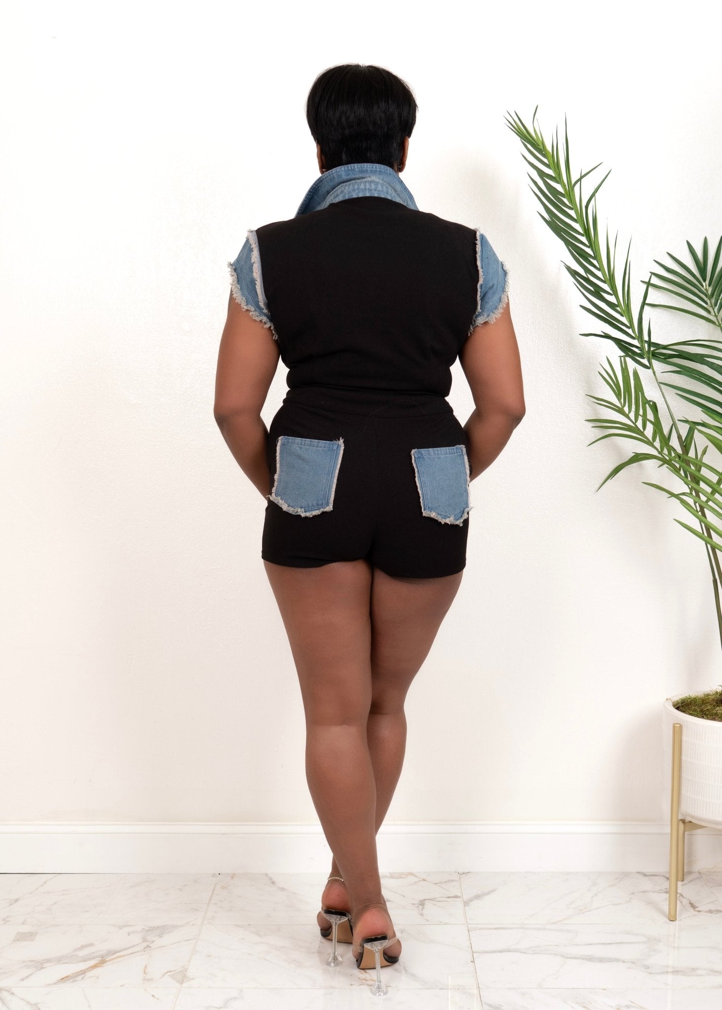 Back of black button-up romper with denim pocket details and flattering fit – Opulent Gurlz Boutique