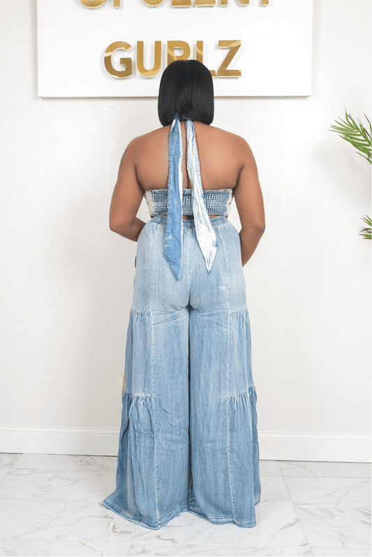 Back view of the Denim Love Story set showing the open tie-back halter and full-length flared denim pants.
