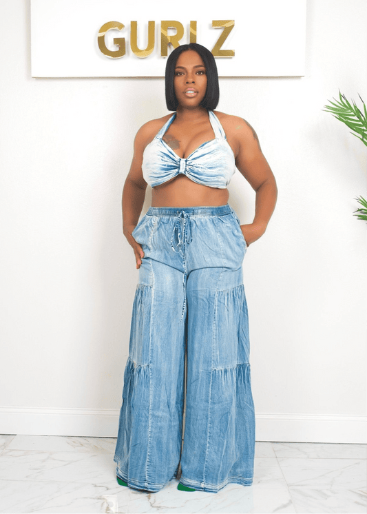 Woman wearing Denim Love Story 2-piece set from Opulent Gurlz, featuring a halter sweetheart top and flowy wide-leg pants.