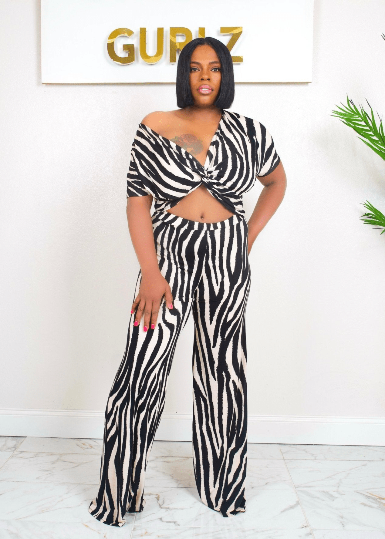 Front View: Model wearing Miami Vice zebra print off-shoulder two-piece set – Opulent Gurlz