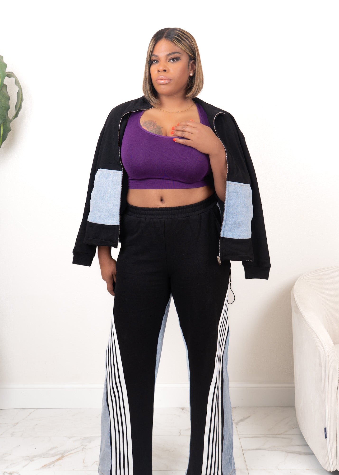 Black contrast track set with zip-up jacket and high-waisted wide-leg pants featuring white and denim panel detailing