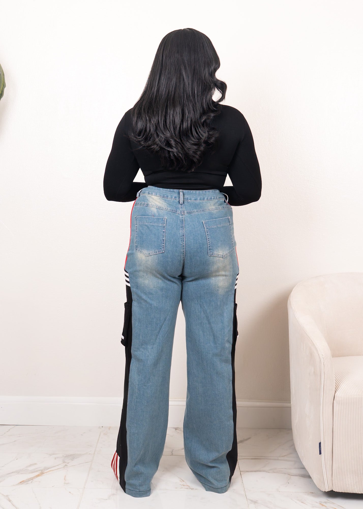 Back view of wide-leg denim contrast track pants with black panels, red stripe accents, and high-waisted streetwear fit

