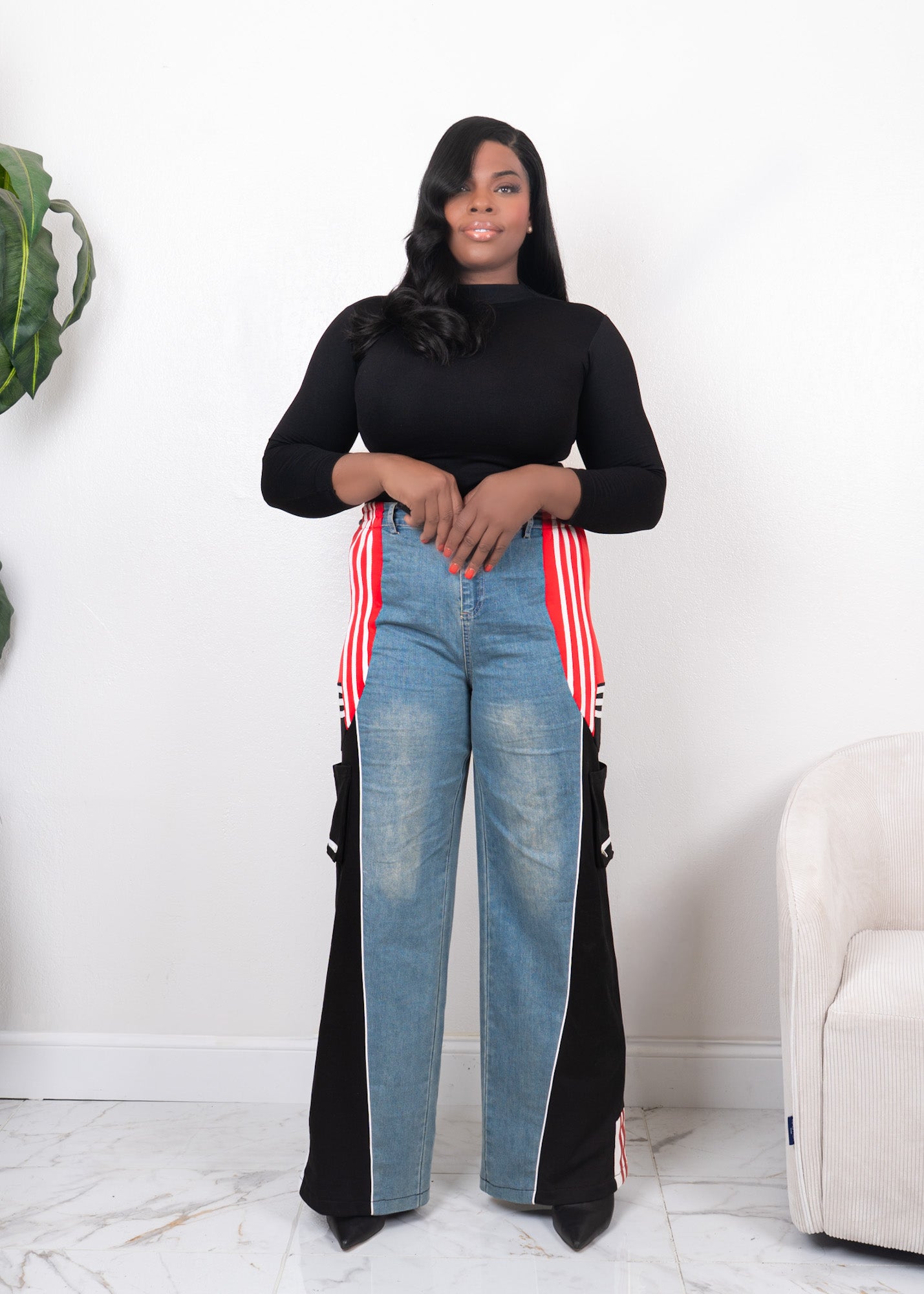 Front view of wide-leg denim contrast track pants with red side stripes, black panels, and high-waisted streetwear fit
