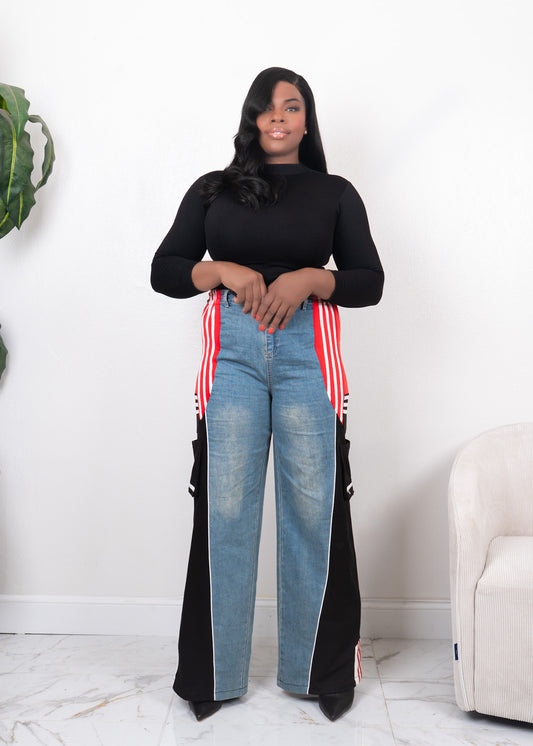 Front view of wide-leg denim contrast track pants with red side stripes, black panels, and high-waisted streetwear fit
