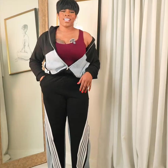 Explanation video detailing the Midnight Motion contrast tracksuit, featuring a zip-up jacket and wide-leg pants, highlighting fit, stretch, and everyday comfort.