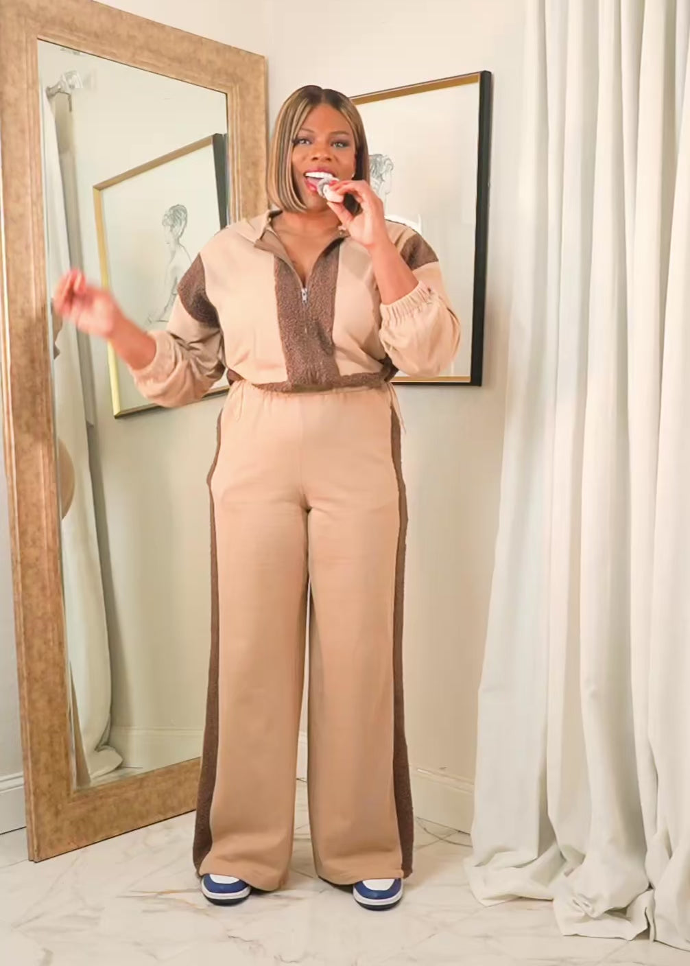 
Video explaining the fit and details of the Mocha Luxe contrast track suit with zip-up jacket and wide-leg pants, highlighting comfort, stretch, and everyday wear.