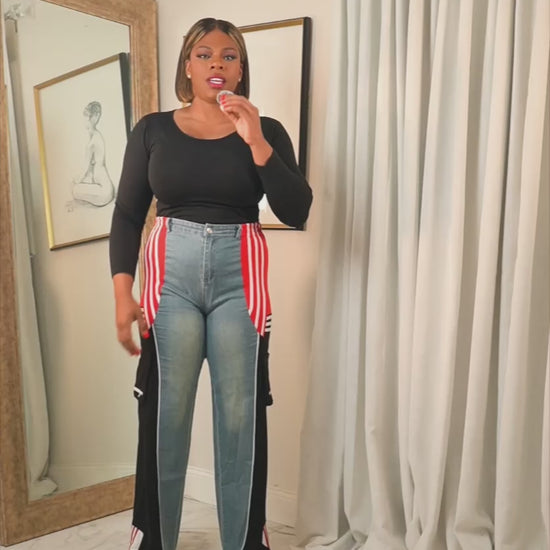 Midnight Motion Remix track pants featuring wide-leg fit with contrast side panels, shown in a try-on video highlighting length, movement, and relaxed silhouette