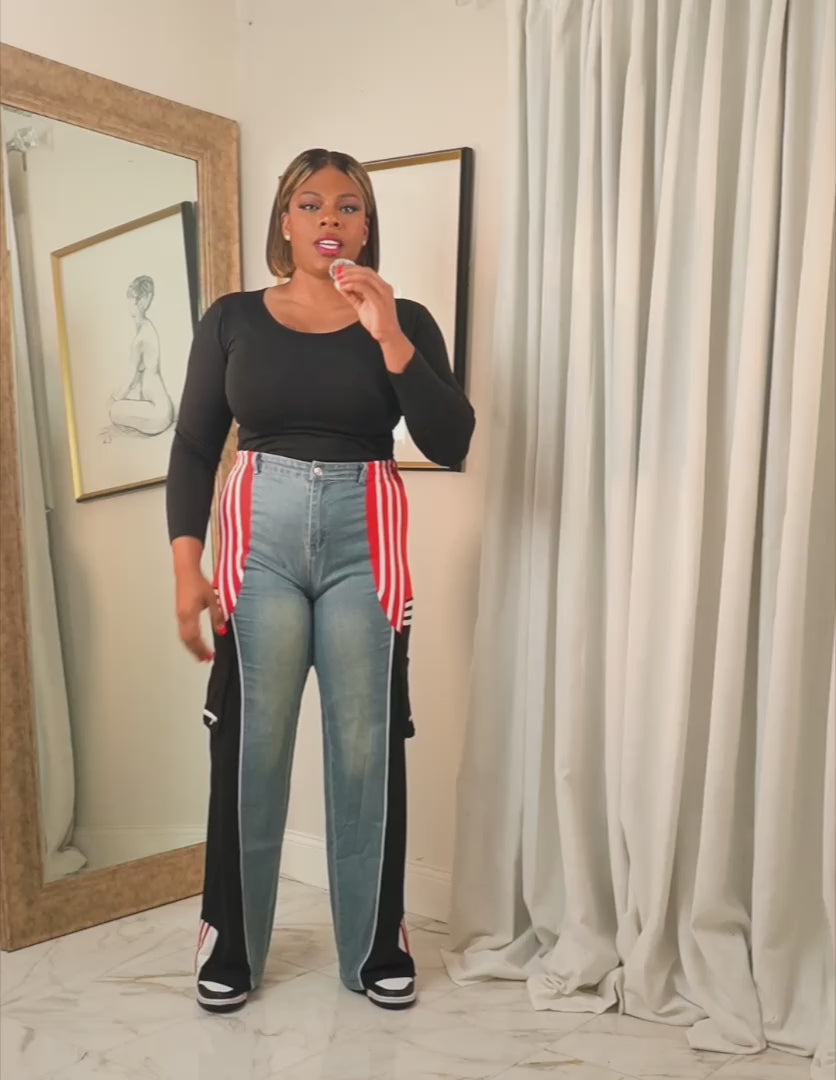 Midnight Motion Remix track pants featuring wide-leg fit with contrast side panels, shown in a try-on video highlighting length, movement, and relaxed silhouette