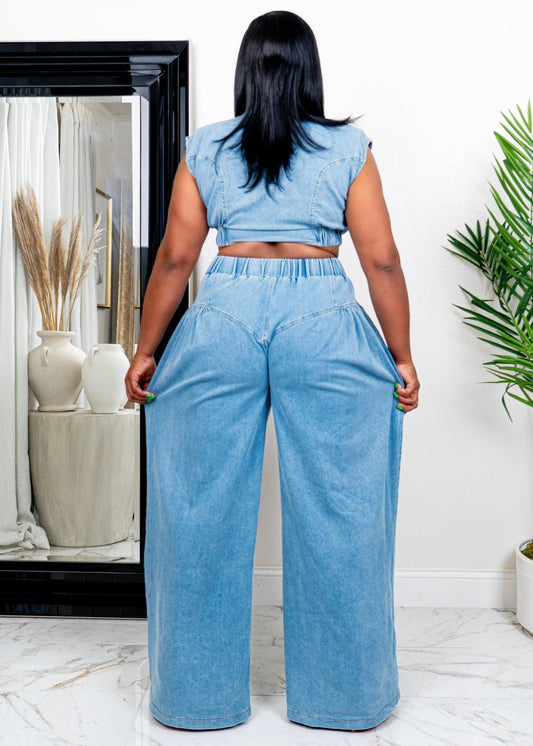 Back view of tall woman wearing soft blue two-piece set with high-waisted wide-leg pants and cropped collared top – stylish matching outfit from Opulent Gurlz.
