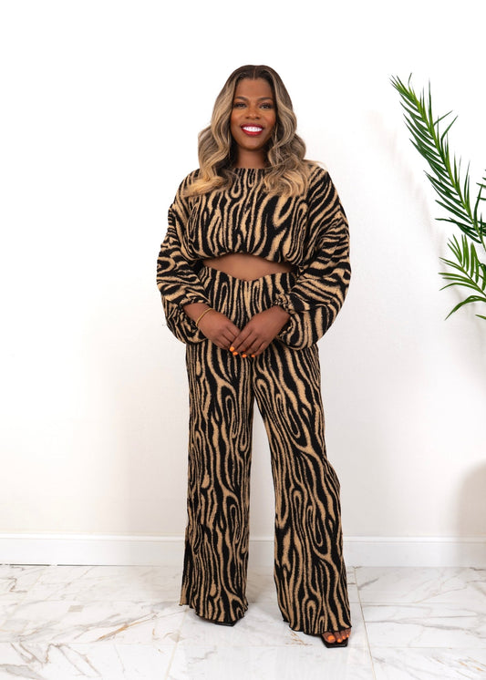Front view of Model wearing The Wild Statement Set – two-piece abstract swirl knit lounge set in black and tan, styled indoors for fall fashio