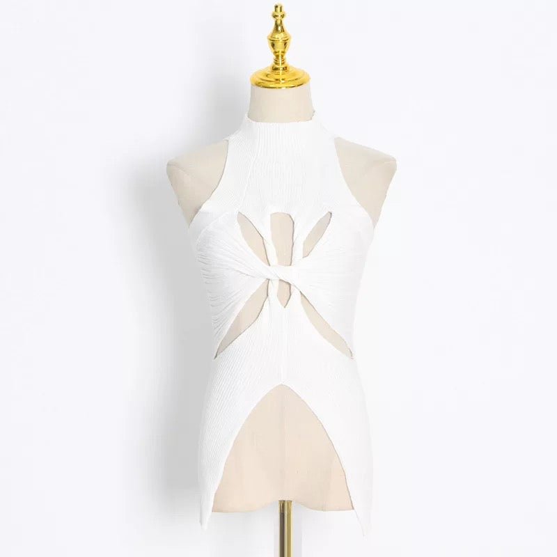 White sleeveless ribbed sweater top with twist front and bold cutout detail on mannequin – edgy knitwear for women
