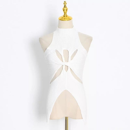White sleeveless ribbed sweater top with twist front and bold cutout detail on mannequin – edgy knitwear for women
