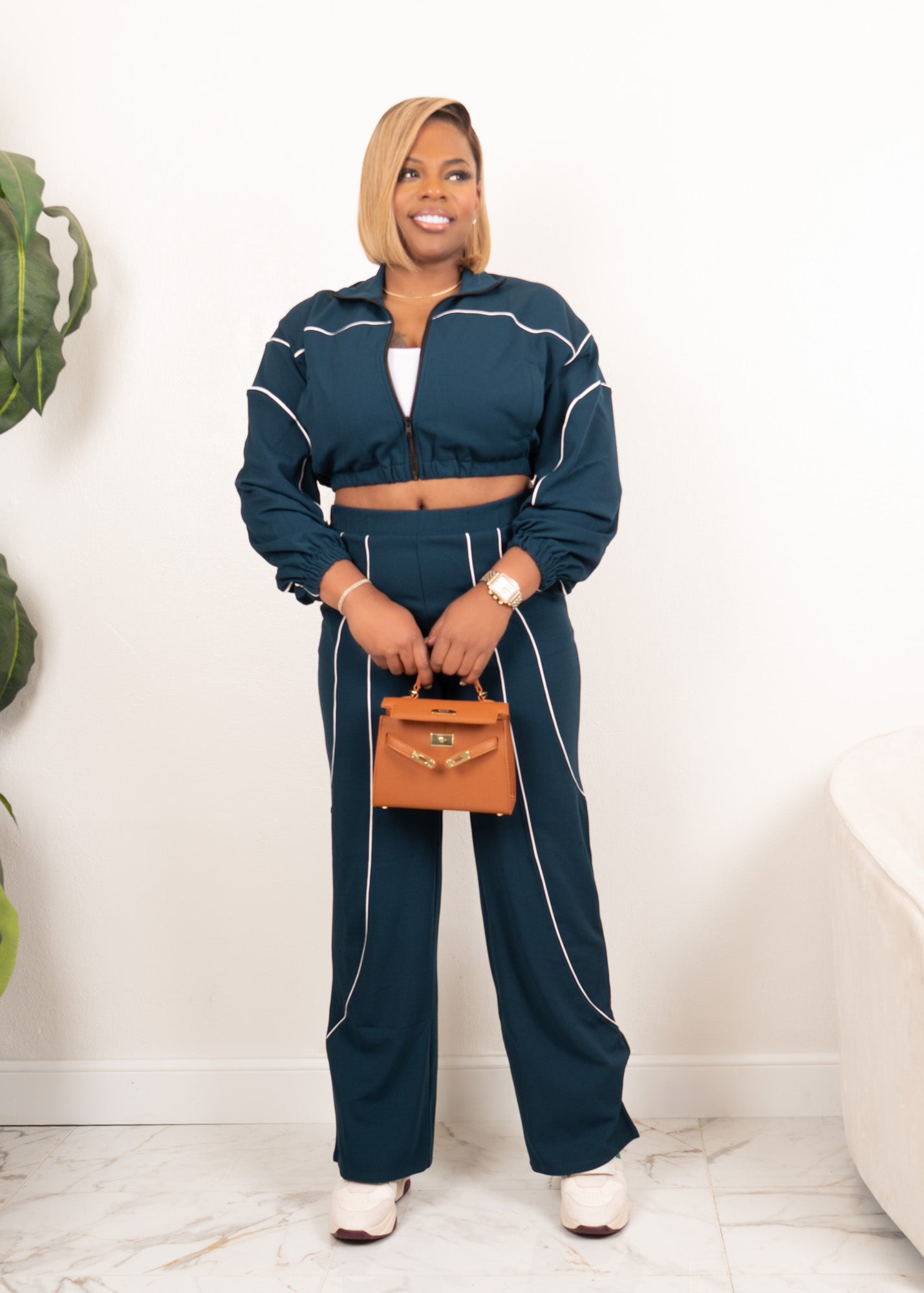 Women’s hunter green ivory contrast piped two-piece track set, front view, cropped zip jacket and wide leg pants, white background.